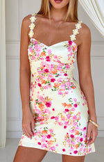 Close-up of the yellow bloom floral satin mini dress with sweetheart neckline and delicate 3D floral straps