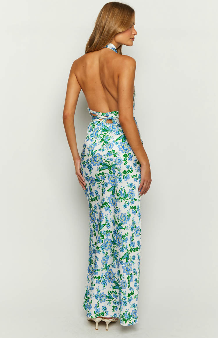 Back view of the white floral maxi dress showing the halter neck, open back, and side waist cutouts