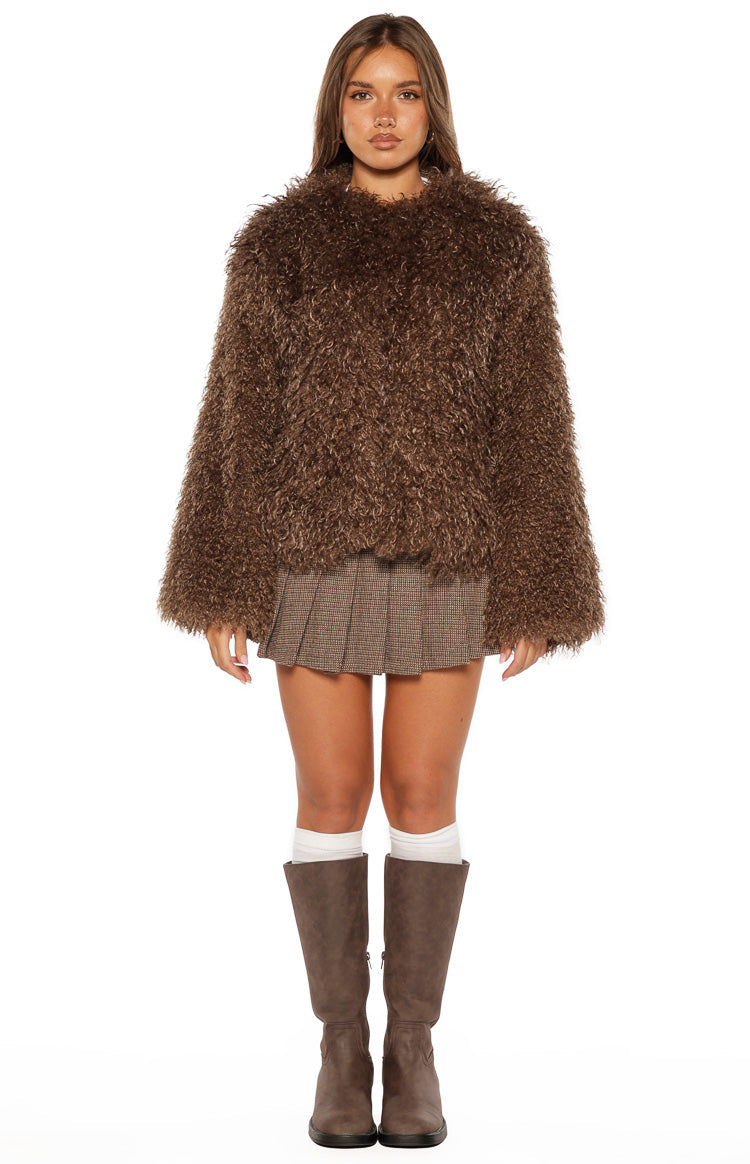 Front view of a brown shaggy faux fur jacket with a round neckline and wide long sleeves, cropped at the waist