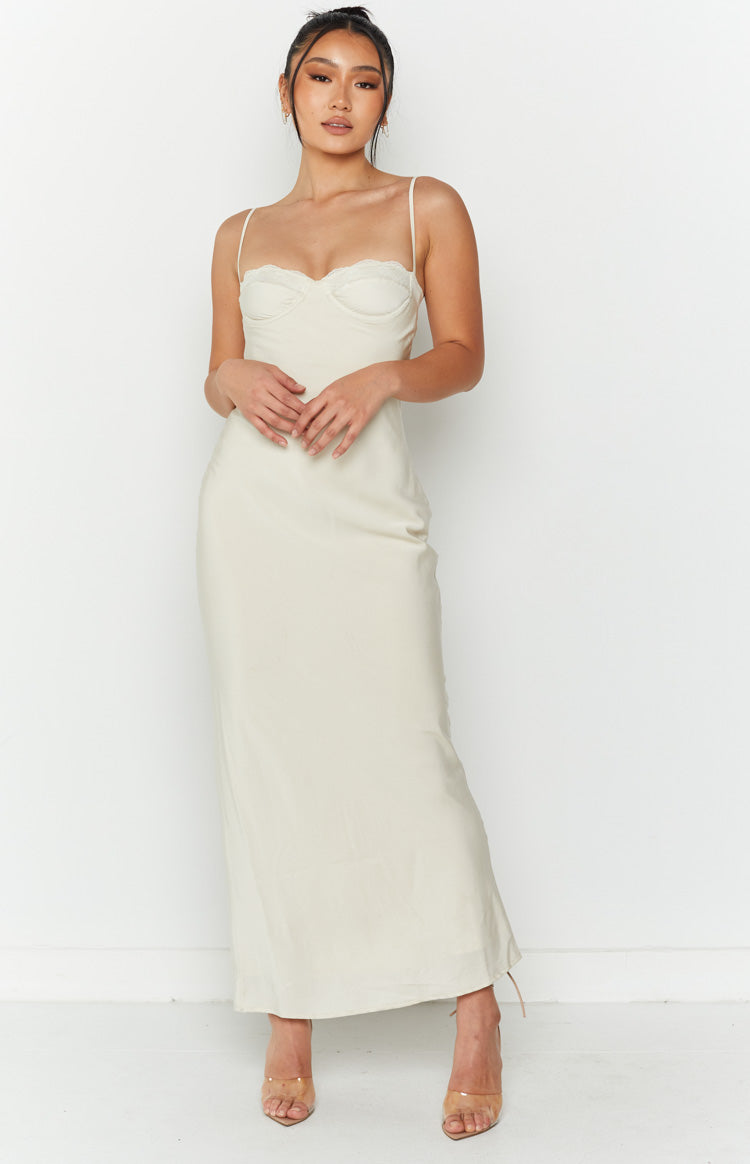 Cream midi dress with a sweetheart lace-trimmed neckline, structured bust, and thin spaghetti straps