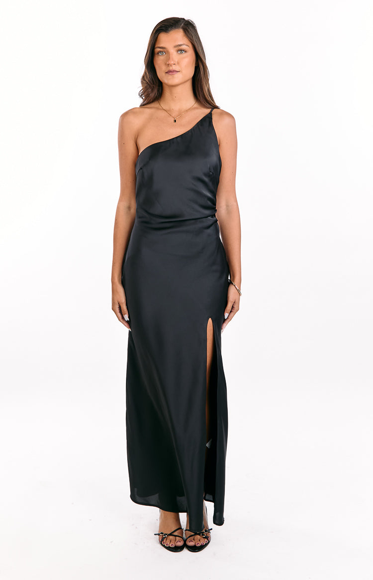 Black satin one-shoulder maxi dress with a high side split and flowing skirt