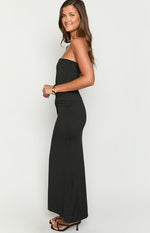 Side view of a black strapless maxi dress showing the ruched detail at the waist and fitted silhouette