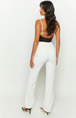 Rear view of high-waisted white pants with a smooth finish and straight leg fit