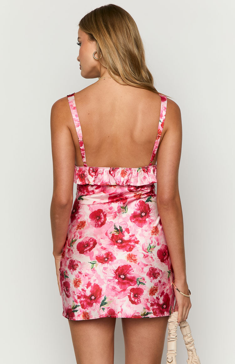 Rear view of the pink floral mini dress with thin adjustable straps and a ruffled back bodice
