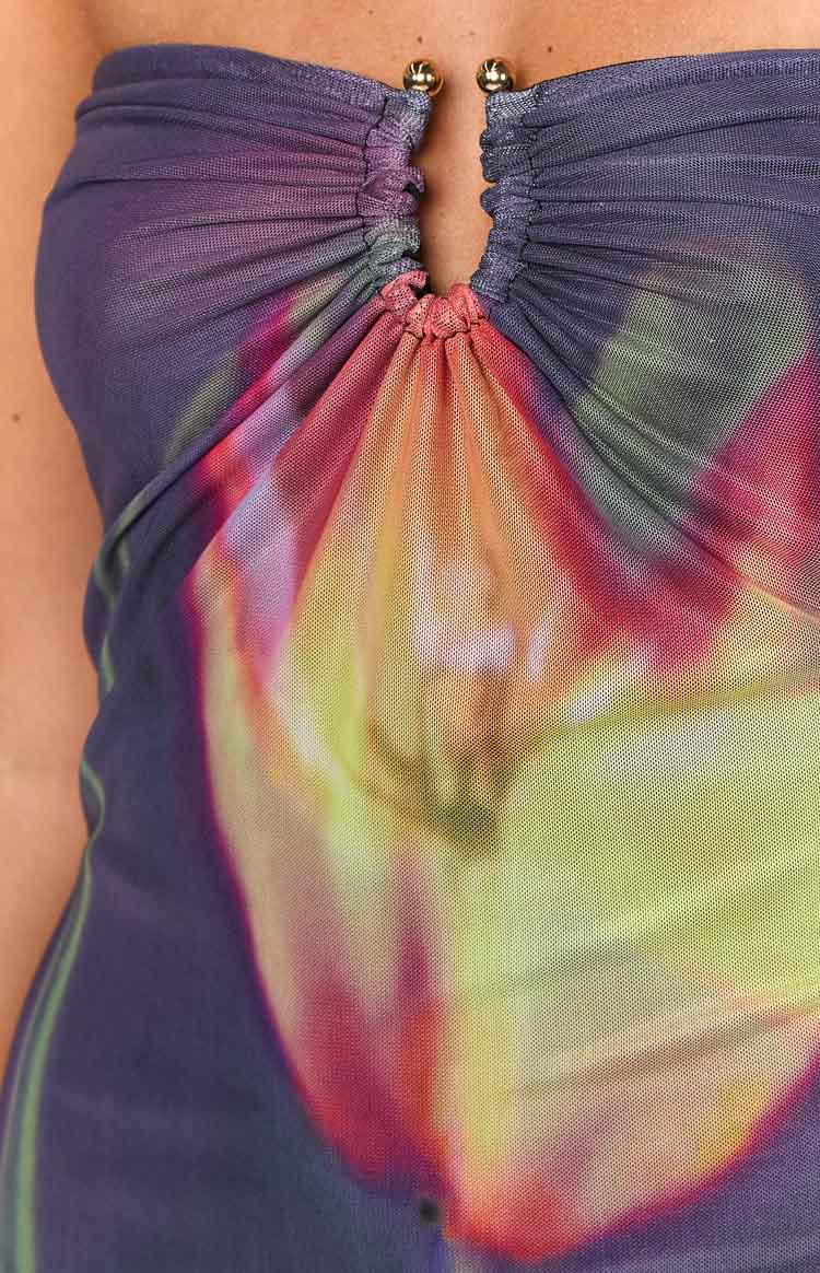 Detail of the ruched strapless neckline with a keyhole cutout and gold beads on a vibrant abstract mesh midi dress