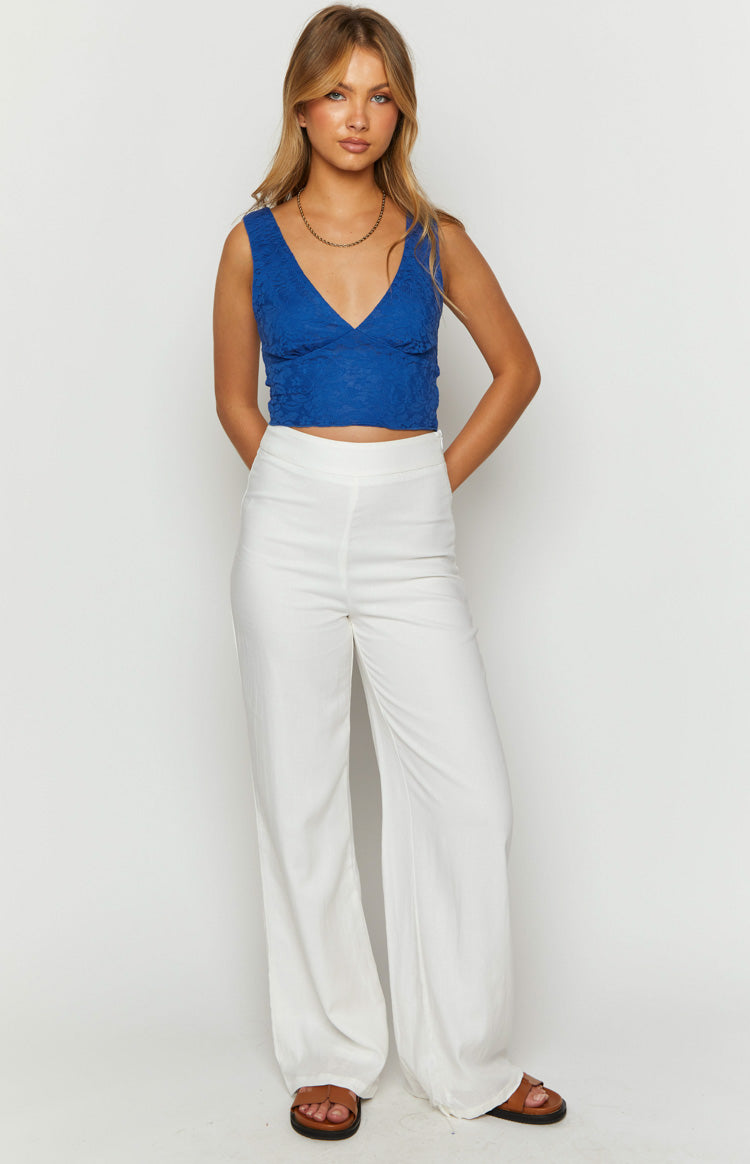 Close-up of the royal blue floral lace crop top with a deep V-neckline and wide shoulder straps