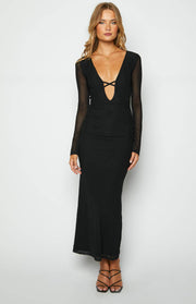 Front view of a black maxi dress with a deep V-neck, criss-cross front detail, sheer long sleeves, and a bodycon skirt