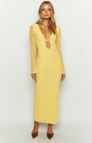 Yellow maxi dress with a deep V-neck, criss-cross detail, and sheer long sleeves