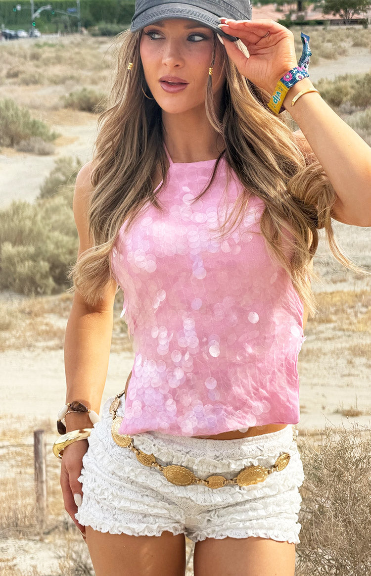 Pink sequin halter neck top featuring a high neckline and shimmering disc sequins