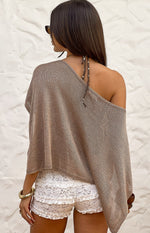 Rear view of white lace micro shorts with multiple tiered ruffles