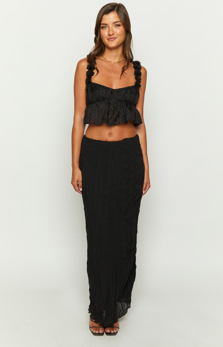 Black textured crop top with ruffled shoulder straps, sweetheart neckline, and a ruffled peplum hem