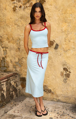 Beginning Boutique Myles Blue Tie Waist Jersey Midi Skirt â€” light blue jersey midi skirt with a red tie waist and red trim