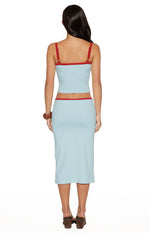Rear view of the light blue jersey midi skirt, showing the red trim at the waist