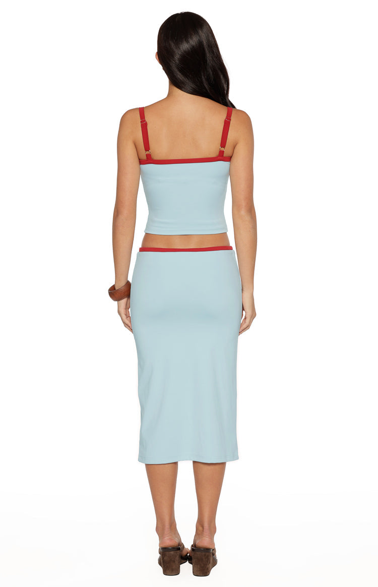 Rear view of the light blue jersey midi skirt, showing the red trim at the waist