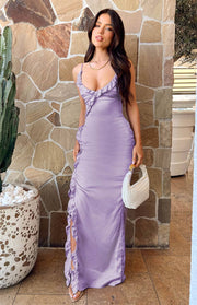 Lilac satin maxi dress with a ruffled V-neckline, spaghetti straps, and a ruffled side slit