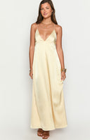 Beginning Boutique Nakita Yellow Maxi Dress pale yellow satin V-neck maxi dress with spaghetti straps and a low scoop back with tie detail