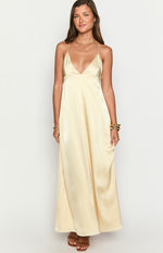 Front view of a yellow satin maxi dress with a deep V-neckline and delicate spaghetti straps