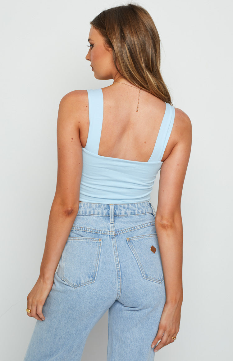 Sky blue knit crop top with wide shoulder straps and a square back neckline