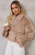 Textured light brown faux fur jacket with a wide collar and long sleeves with flared cuffs