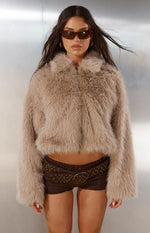 Light brown cropped faux fur jacket with a shaggy texture and wide collar