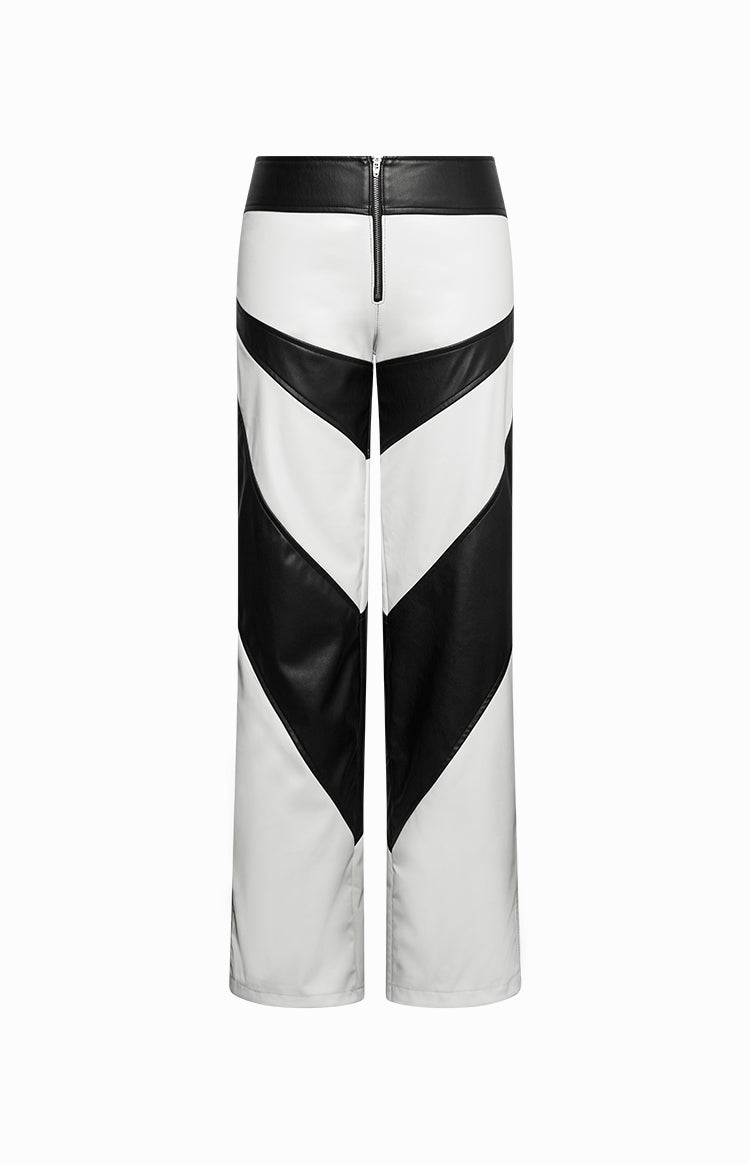 Rear view of white and black PU pants with a chevron pattern and exposed black back zipper