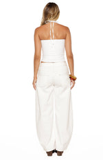 Rear view of a white jersey halter neck top with a tie-back detail