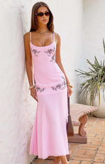 Light pink midi dress with black floral embroidery on the bodice and lower skirt, thin straps