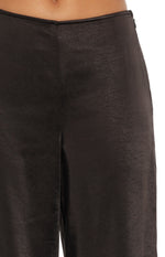 Black satin pants close-up with a V-front waistband and invisible side zipper detail