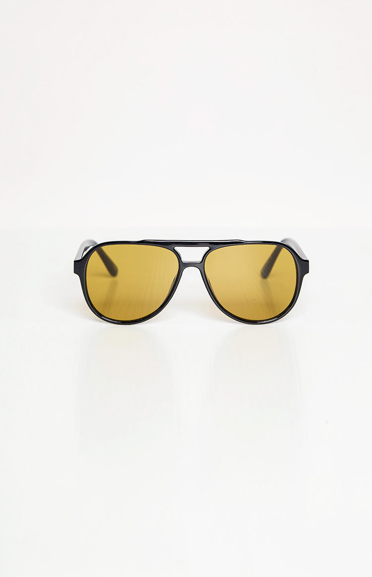 Black aviator sunglasses with yellow lenses and a prominent double bridge