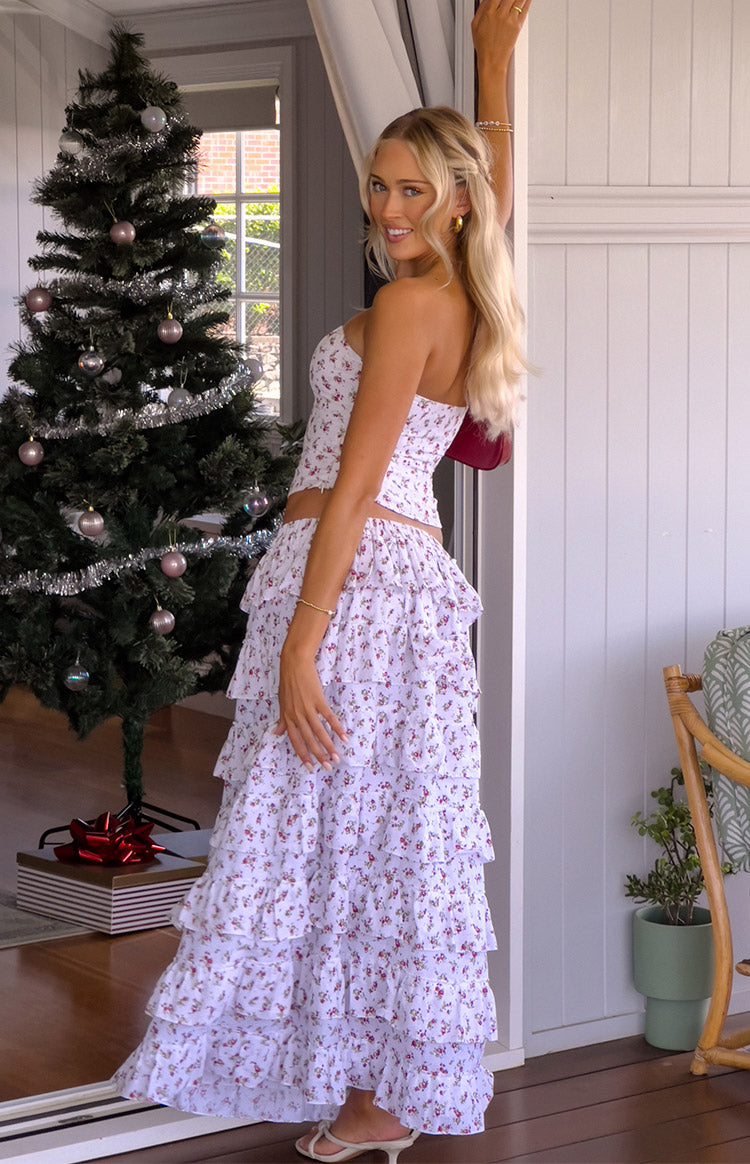 Side view of the white paisley floral maxi skirt with cascading tiered ruffles