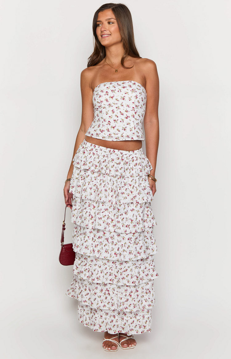 White floral tiered ruffle maxi skirt with multiple layers of ruffles and an elasticated waist