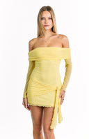 A sheer- off-the-shoulder mini-dress in a light yellow color- featuring a ruched bodice- long sleeves with a ruffled hem- and a tied sash that hangs down at the front.