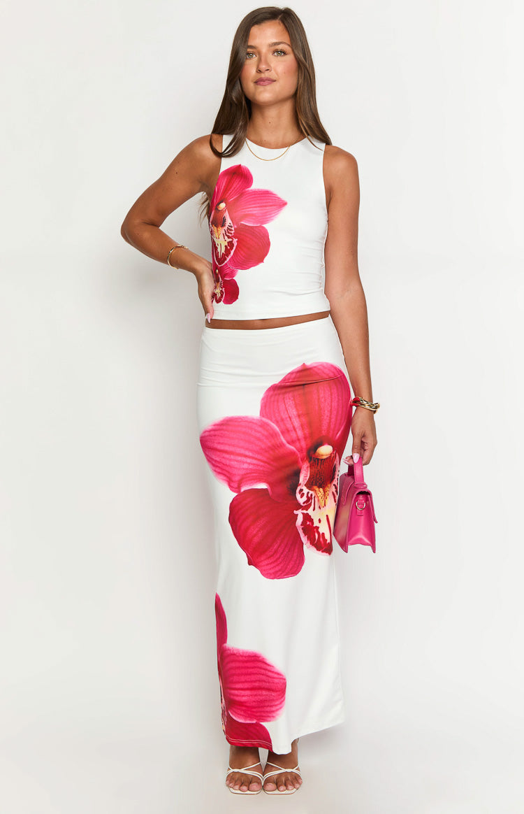 Front view of a white fitted cropped tank top with a large pink orchid print