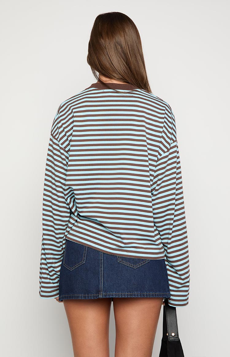 Dark denim mini skirt from the back, showing two patch pockets and light brown stitching