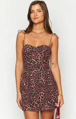 Close-up of the leopard print mini dress showing the sweetheart neckline and tie-shoulder spaghetti straps
