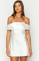 Beginning Boutique Primrose White Satin Off the Shoulder Mini Dress white satin mini dress with ruched off-shoulder sleeves and a tie-back