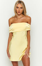 Front view of a primrose yellow satin off-the-shoulder mini dress with a ruched band