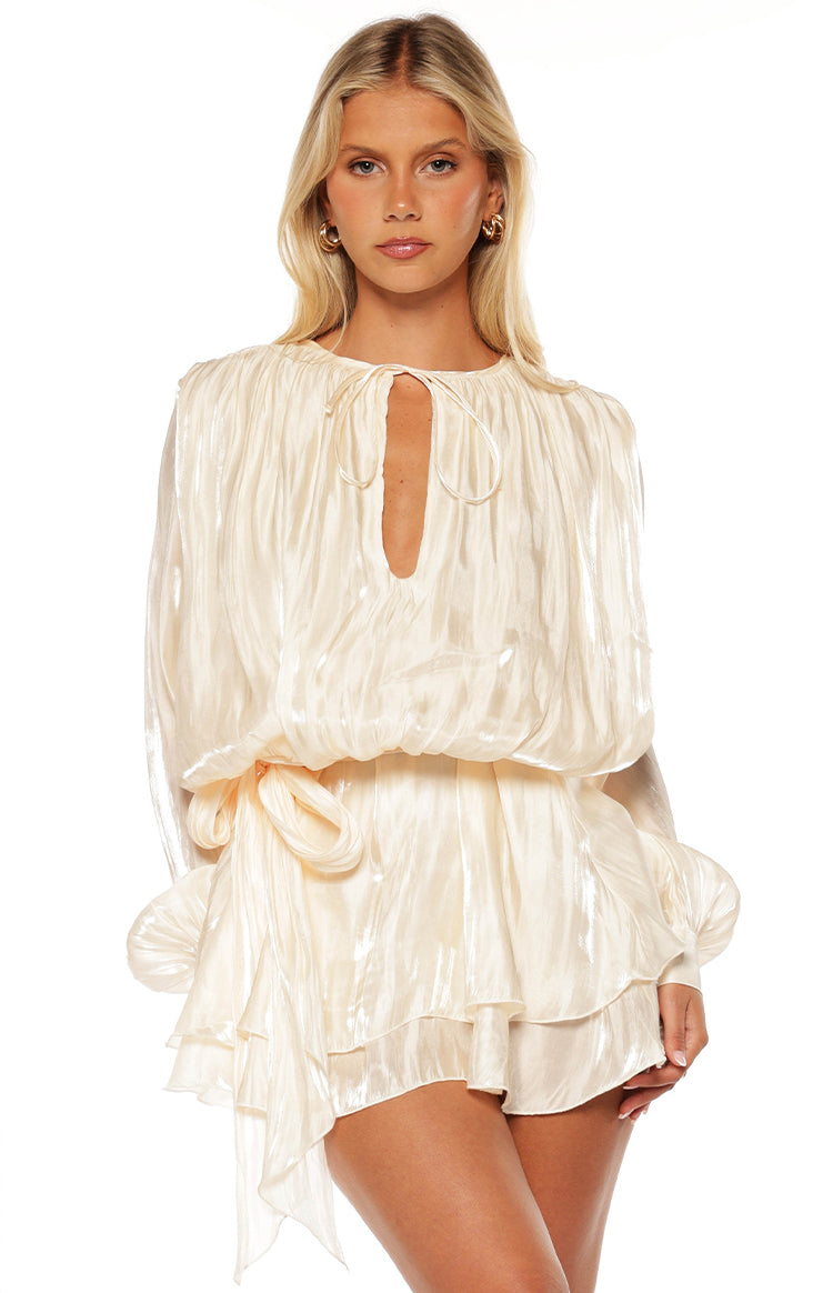 Pearl satin long sleeve mini dress with keyhole tie neckline, blouson bodice, and ruffled skirt