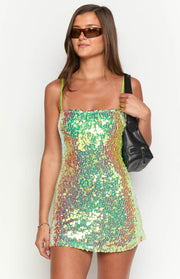 Front view of an iridescent green and yellow sequin mini dress with a square neckline and thin neon green spaghetti straps