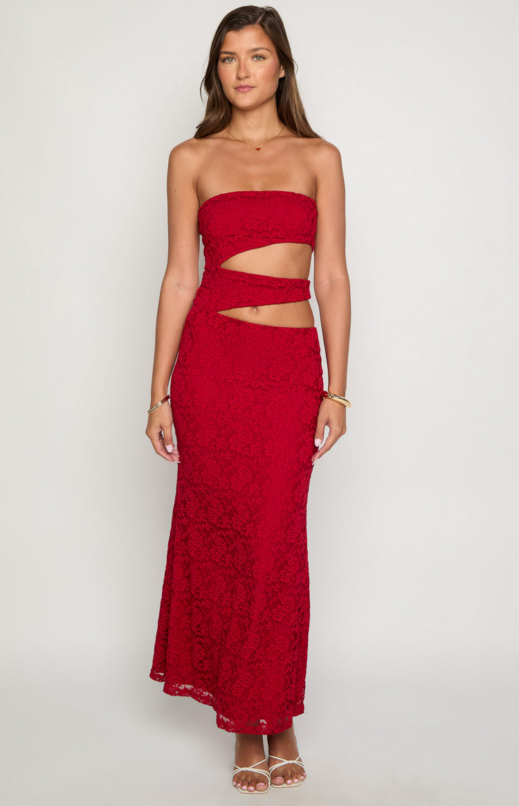 Front view of a red strapless maxi dress with two horizontal midriff cutouts and floral lace fabric
