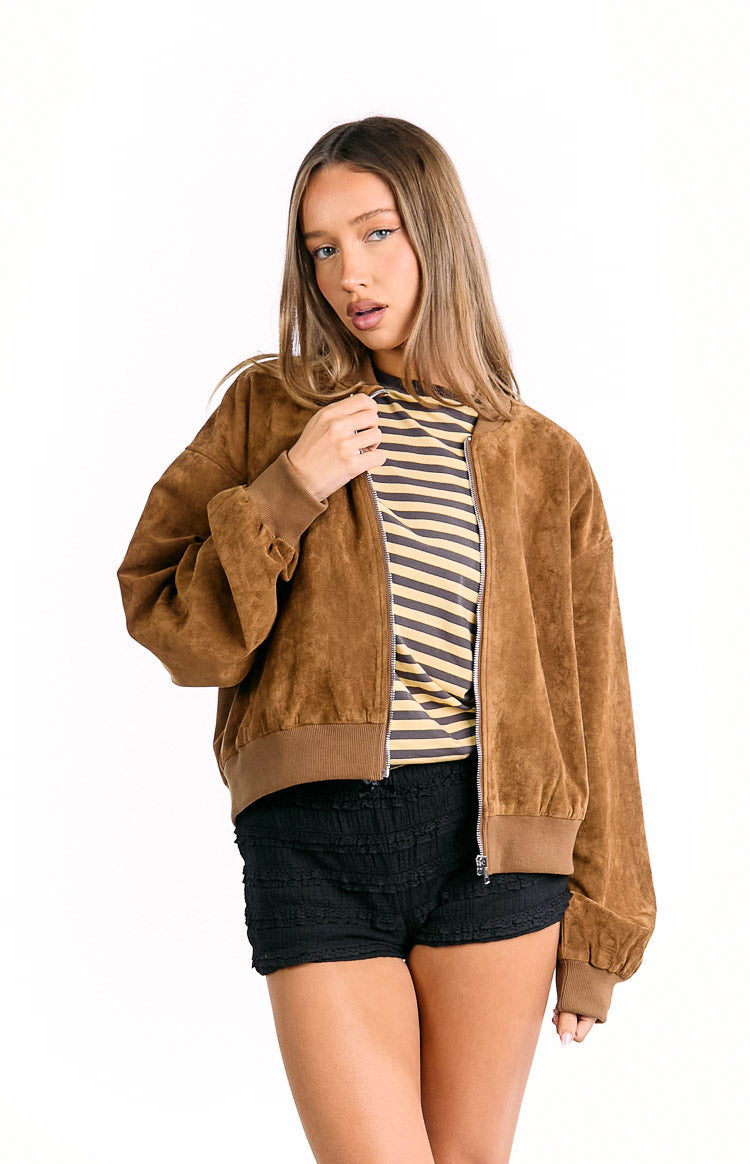 Front view of a tan suedette bomber jacket, partially unzipped, showing the soft texture and ribbed cuffs