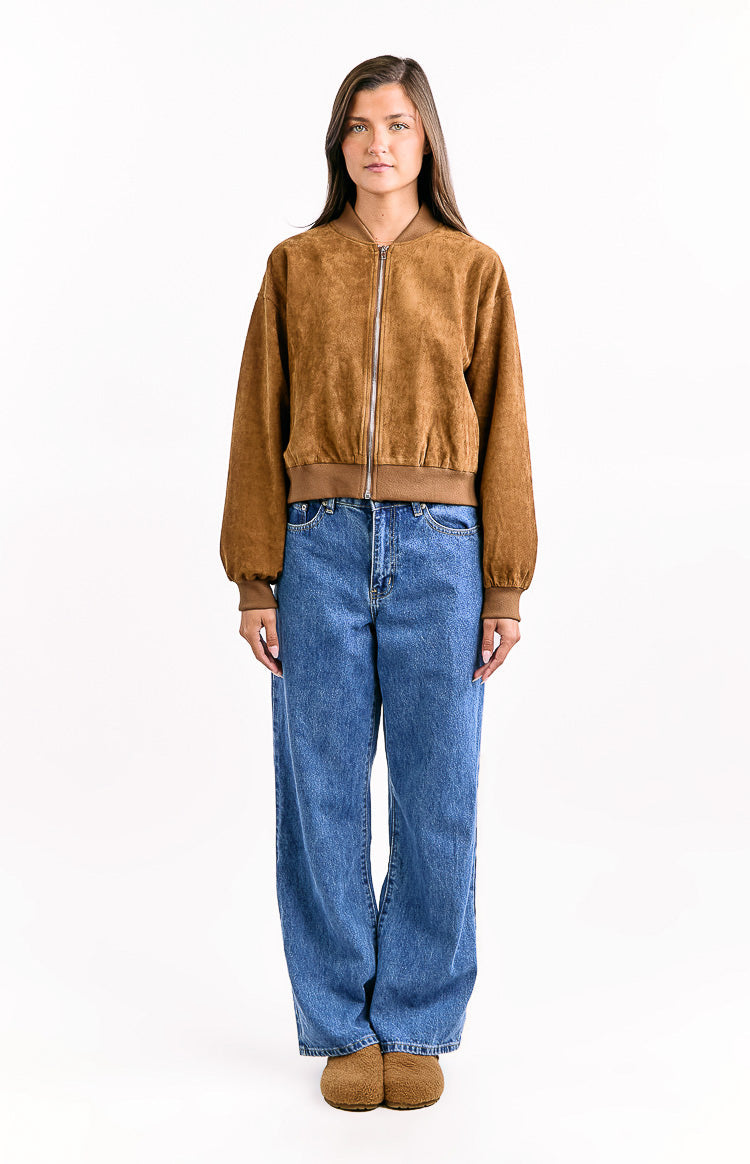 Relaxed fit tan suedette bomber jacket with a ribbed collar, silver zipper, and gathered cuffed sleeves