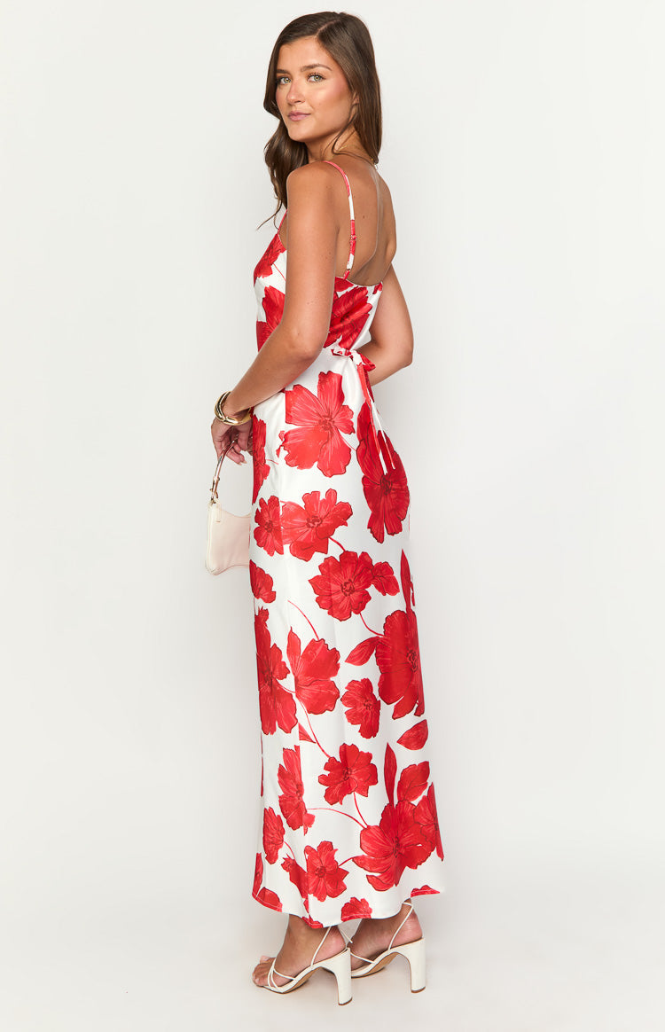 Side view of a white maxi dress with red anemone floral print, showing the tie-back waist and thin spaghetti straps
