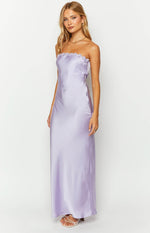 Purple satin strapless maxi dress with a ruffled trim along the straight neckline and a flowing silhouette