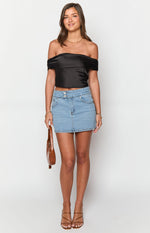 Light wash denim mini skirt with a fitted silhouette and double button waist