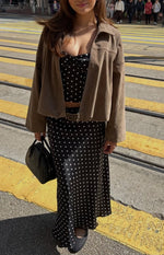 Front view of a brown suedette bomber jacket worn open, showing the silver zipper and pointed collar