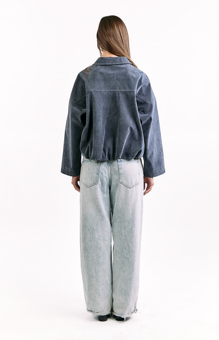 Rear view of a steel grey suedette bomber jacket with a wide collar and elasticated bubble hem