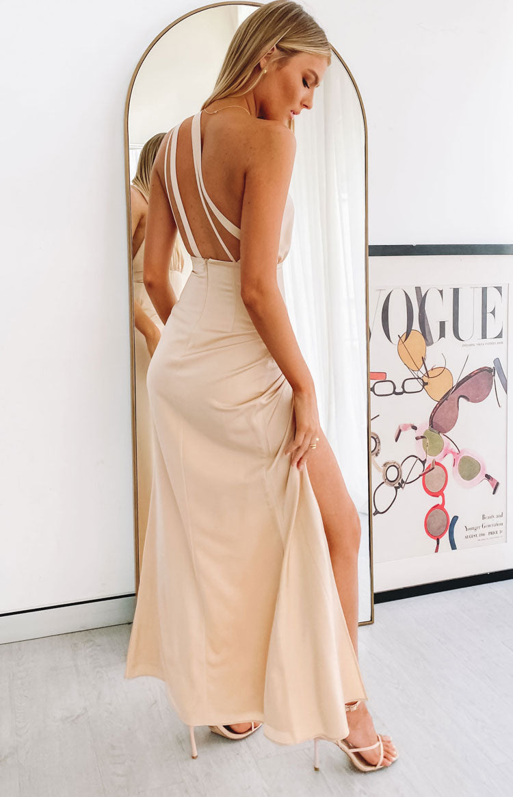 Gold satin maxi dress with a one-shoulder draped bodice, elasticated waist, and high thigh split