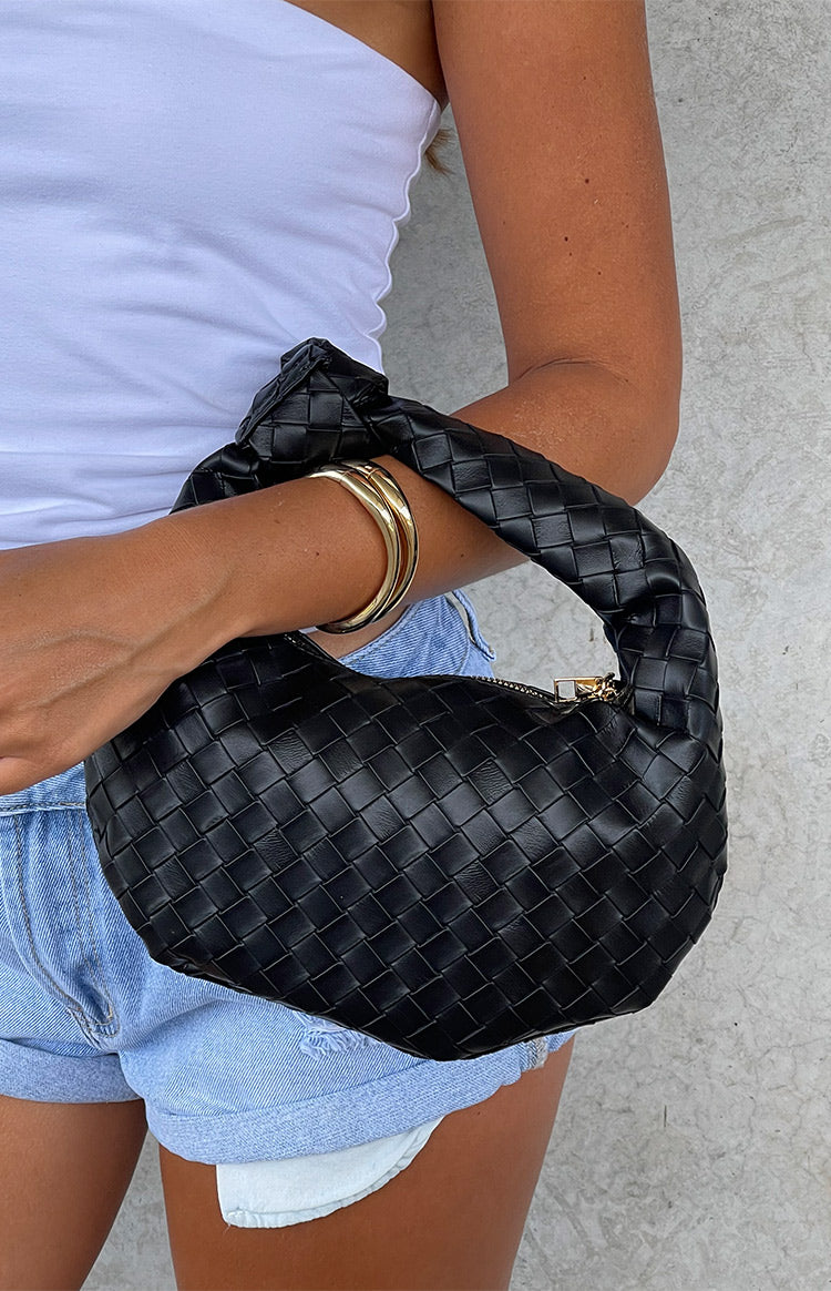 Beginning Boutique Rylie Black PU Shoulder Bag black woven PU crescent shoulder bag with knotted handle and gold zipper