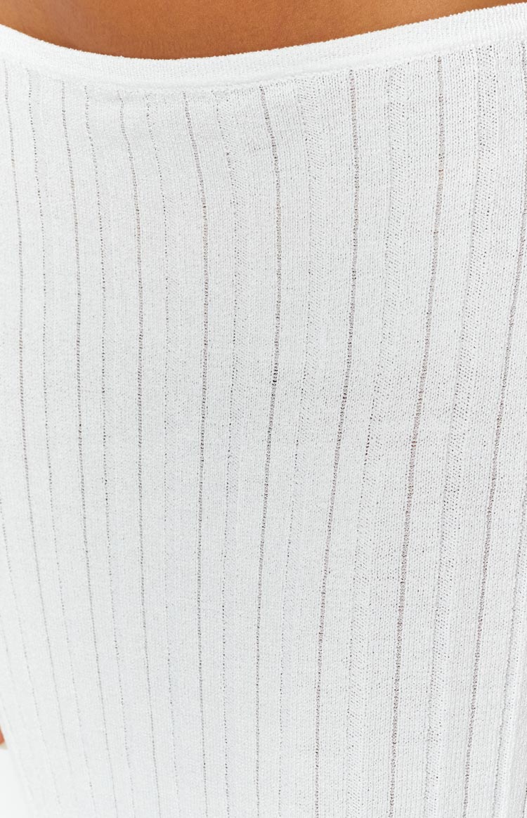 Front view of a white ribbed knit midi skirt with a high waist and a straight, fitted silhouette